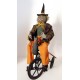 Vintage Primitive Folk Art HALLOWEEN GREEN WITCH on TRIKE by Sylvia Carlson.